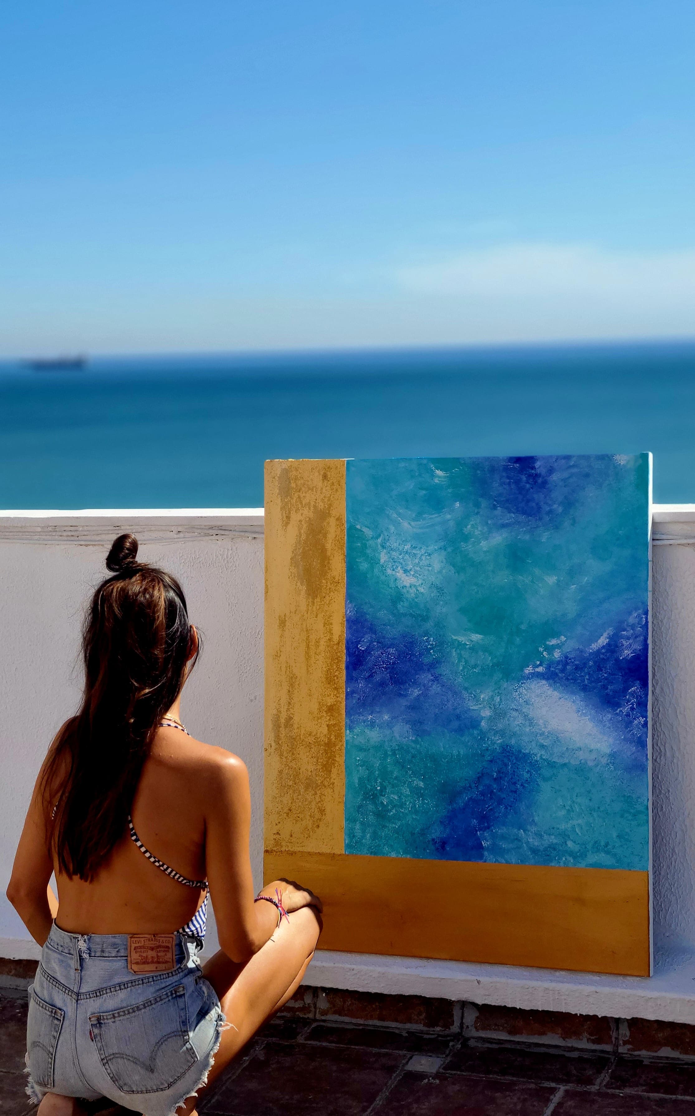 Paula de Motta with a seascape facing the Mediterranean horizon